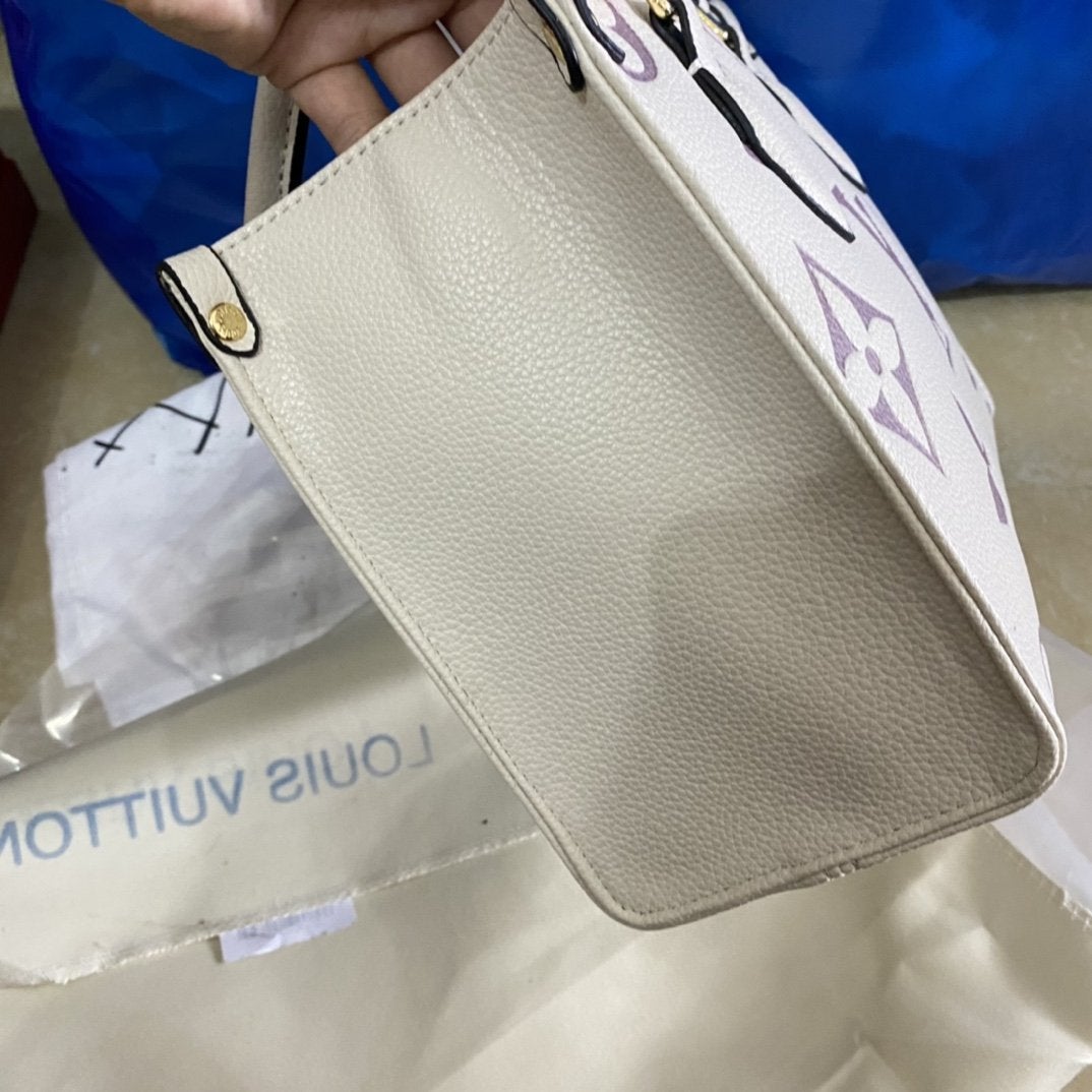 LOUIS VUITTON ONTHEGO PM 25 CREAM EMBOSSED GRAINED COWHIDE LEATHER
