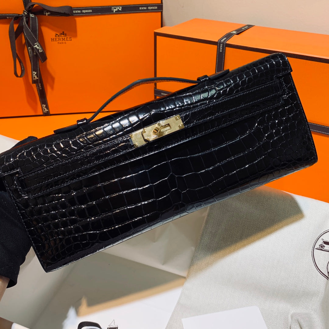 HERMES KELLY CUT 31 IN BLACK SHINY ALLIGATOR LEATHER WITH GOLD HARDWARE