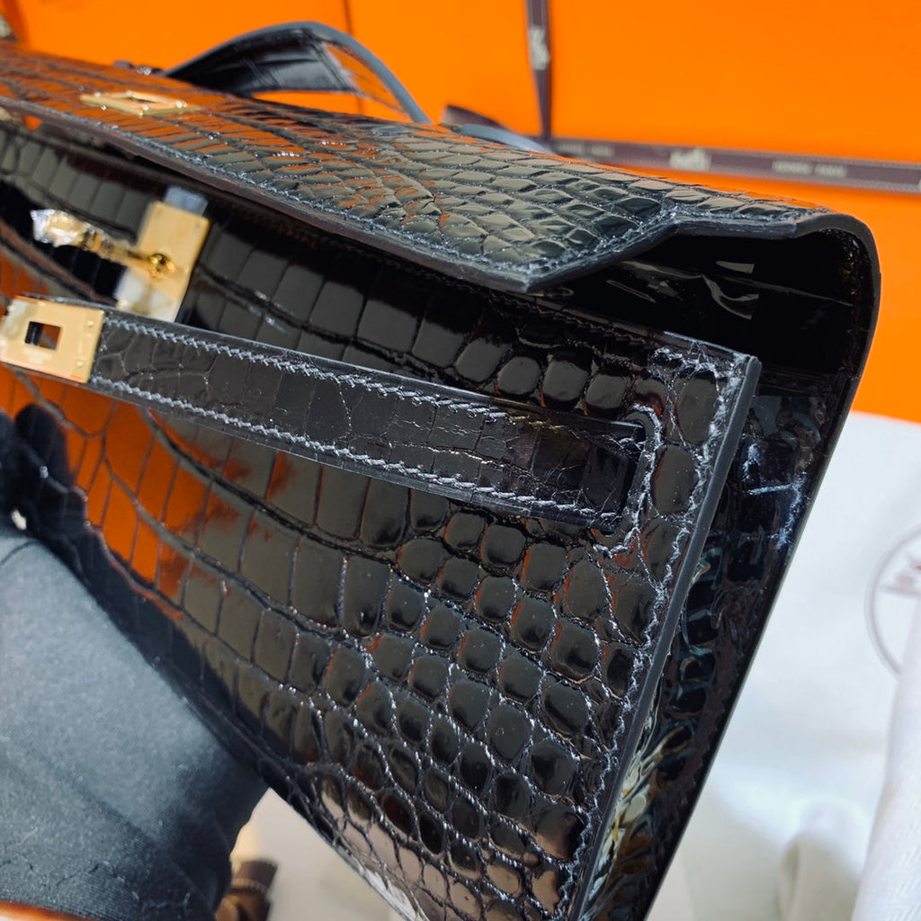 HERMES KELLY CUT 31 IN BLACK SHINY ALLIGATOR LEATHER WITH GOLD HARDWARE