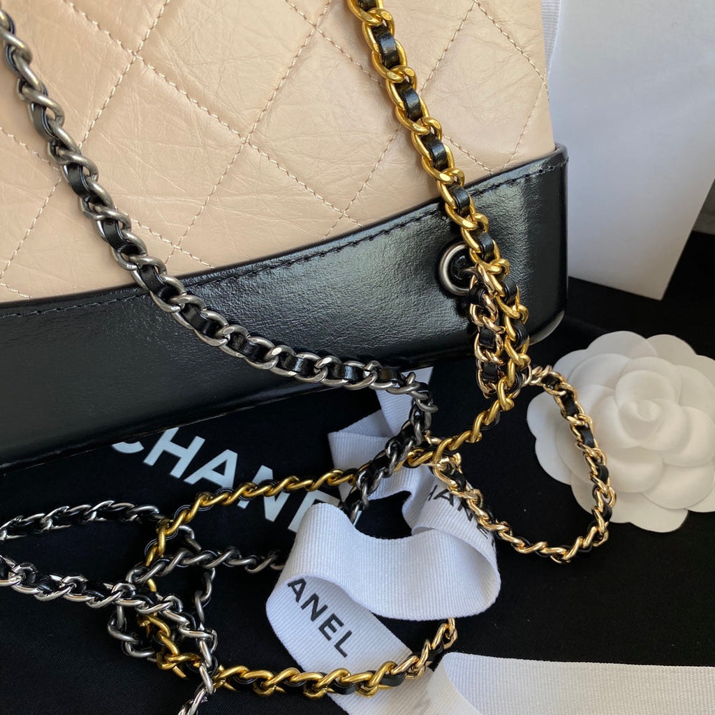 CHANEL GRABRIELLE SMALL 24 BACKPACK IN ALMOND BEIGE MIX BLACK CALFSKIN