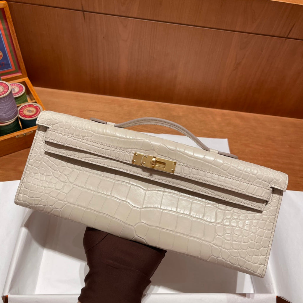 HERMES KELLY CUT 31 IN WHITE CREAM ALLIGATOR LEATHER WITH GOLD HARDWARE