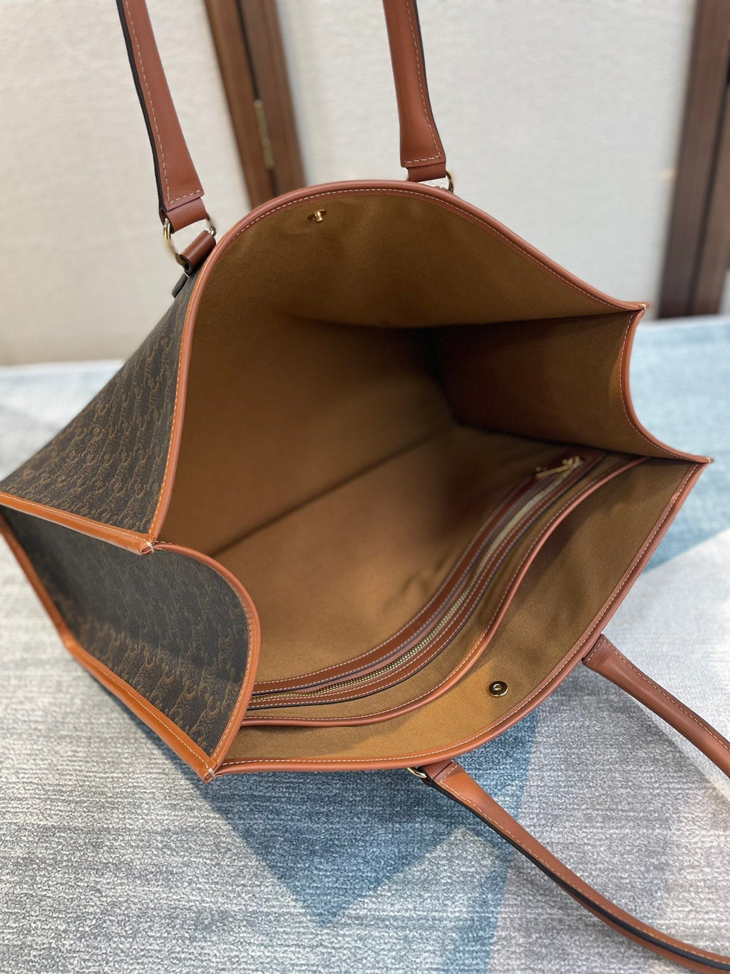 CELINE 25S HORIZONTAL CABAS 43MM IN BLACK TRIOMPHE CANVAS AND TAN BROWN CALFSKIN