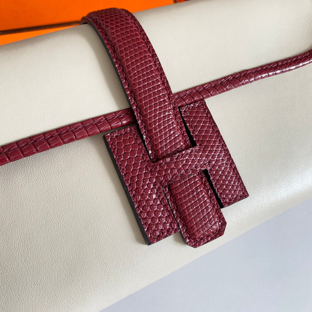 HERMES JIGE ELAN 29 CLUTCH IN WHITE CALFSKIN WITH GARNET RED LIZARD SKIN