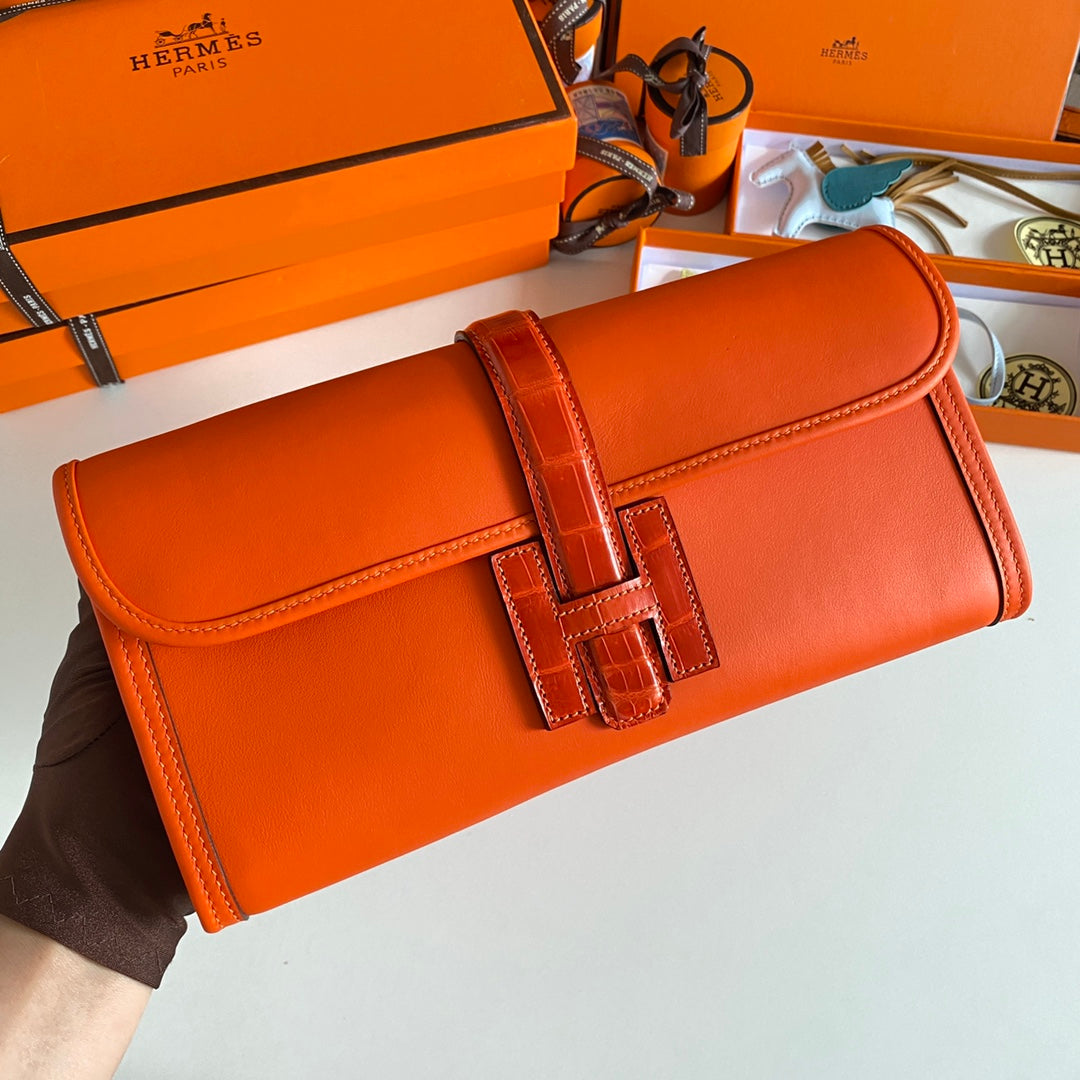 HERMES JIGE ELAN 29 CLUTCH IN BRIGHT ORANGE CALFSKIN WITH LIZARD SKIN