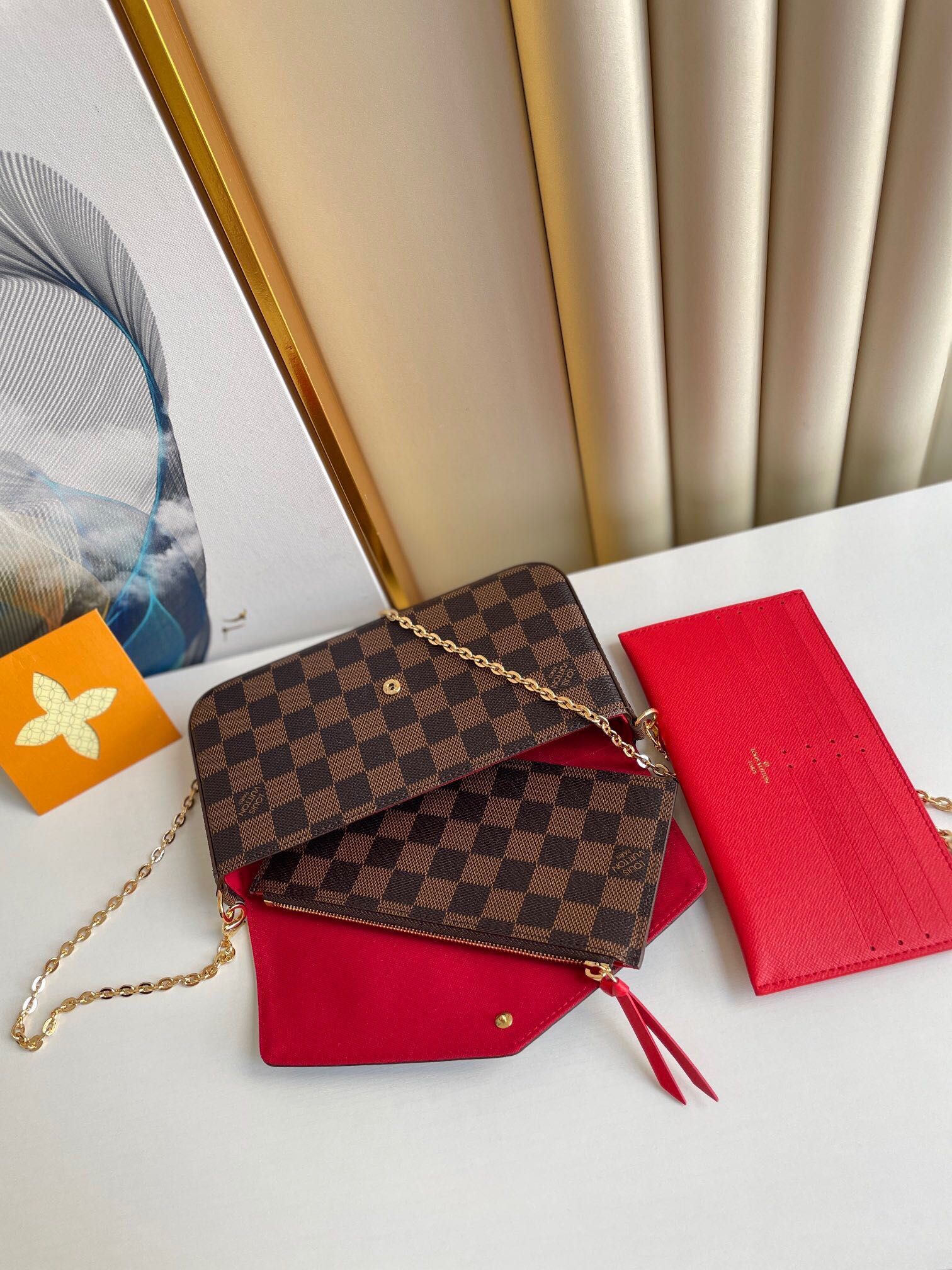 LOUIS VUITTON FÉLICIE POCHETTE 21 IN BROWN DAMIER EBENE COATED CANVAS GOLD HARDWARE
