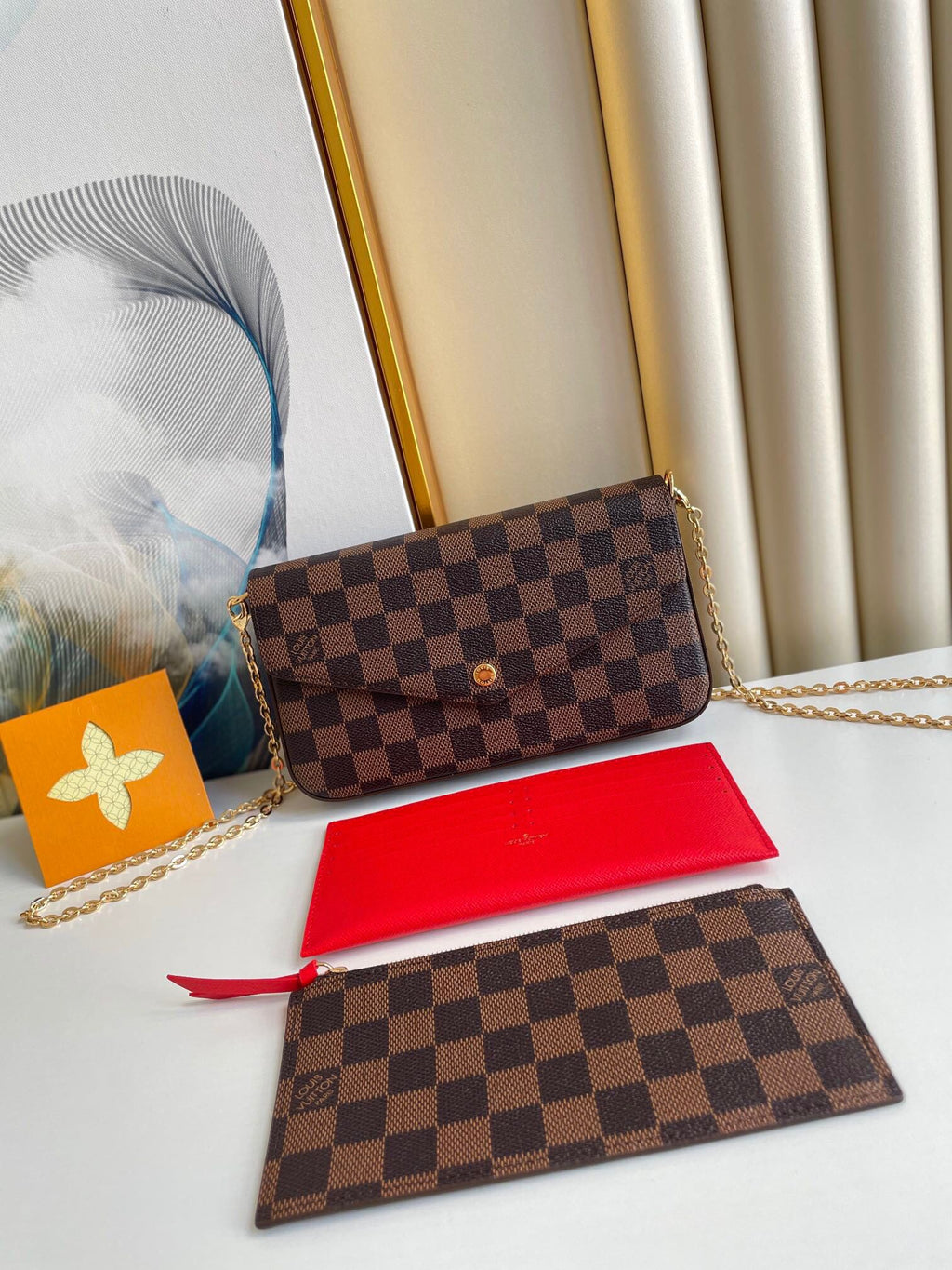 LOUIS VUITTON FÉLICIE POCHETTE 21 IN BROWN DAMIER EBENE COATED CANVAS GOLD HARDWARE