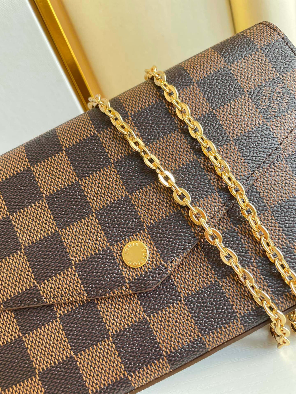 LOUIS VUITTON FÉLICIE POCHETTE 21 IN BROWN DAMIER EBENE COATED CANVAS GOLD HARDWARE