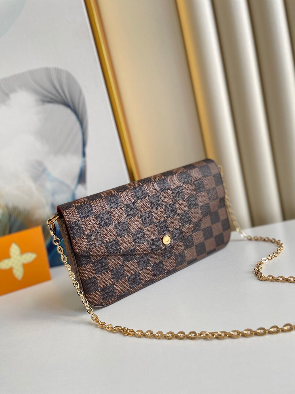 LOUIS VUITTON FÉLICIE POCHETTE 21 IN BROWN DAMIER EBENE COATED CANVAS GOLD HARDWARE