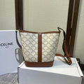 CELINE BUCKET 30 IN WHITE TRIOMPHE CANVAS AND RED BROWN CALFSKIN TRIM