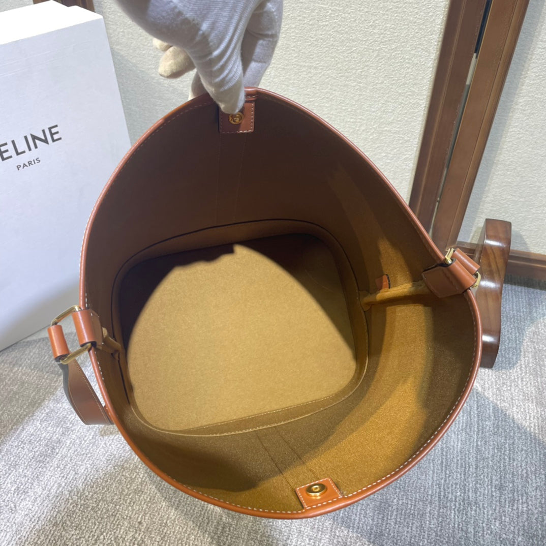 CELINE BUCKET 33 IN WHITE TRIOMPHE CANVAS AND BRONZE BROWN CALFSKIN TRIM