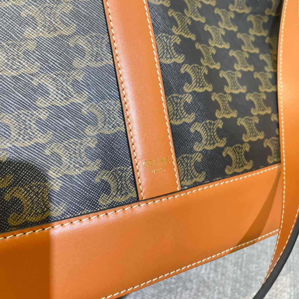 CELINE BUCKET 33 IN BLACK TRIOMPHE CANVAS AND BRONZE BROWN CALFSKIN TRIM