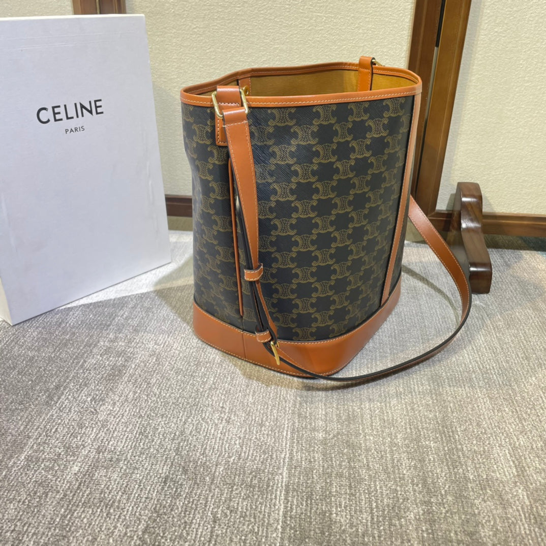 CELINE BUCKET 33 IN BLACK TRIOMPHE CANVAS AND BRONZE BROWN CALFSKIN TRIM
