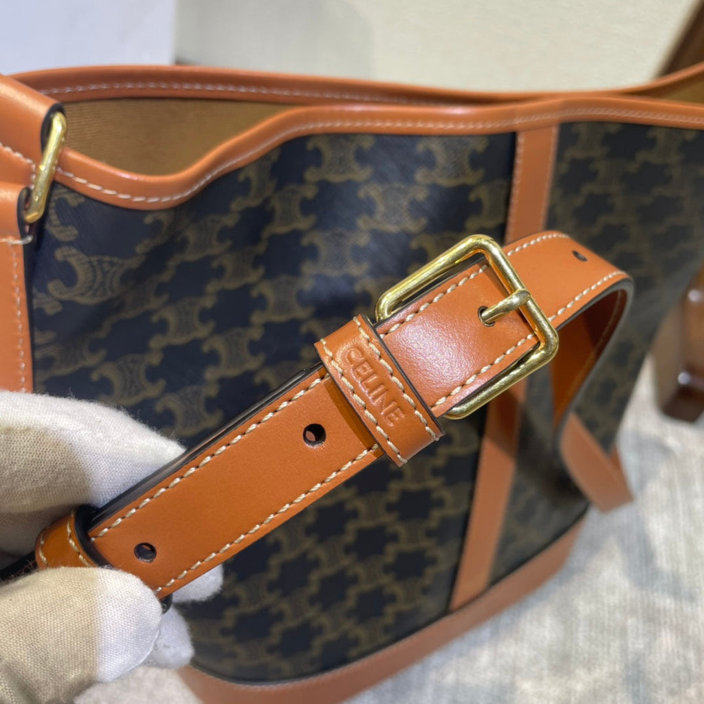 CELINE BUCKET 33 IN BLACK TRIOMPHE CANVAS AND BRONZE BROWN CALFSKIN TRIM