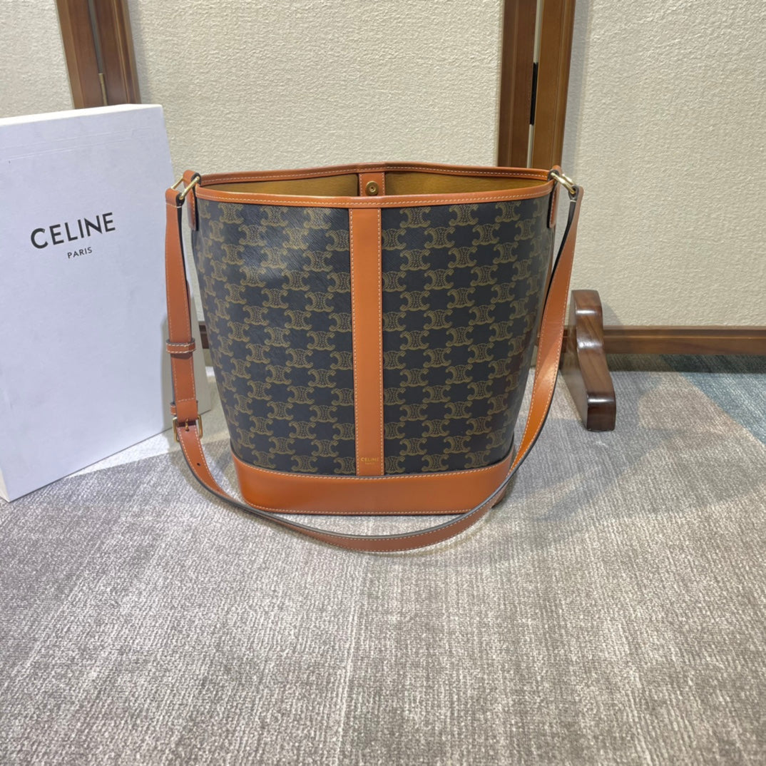 CELINE BUCKET 33 IN BLACK TRIOMPHE CANVAS AND BRONZE BROWN CALFSKIN TRIM