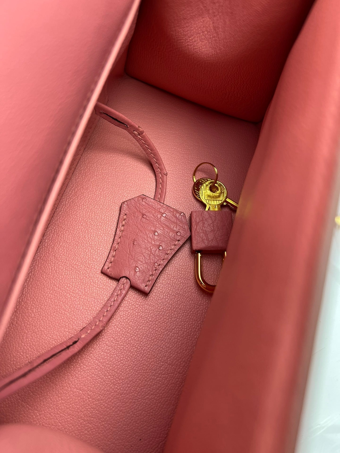 HERMES KELLY BAG 20 IN ROUGE PINK OSTRICH LEATHER WITH GOLD HARDWARE