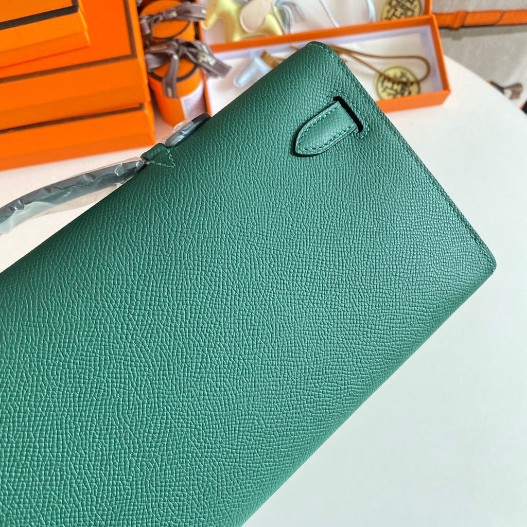 HERMES KELLY CUT 31 IN GREEN FOREST CALFSKIN WITH SILVER HARDWARE