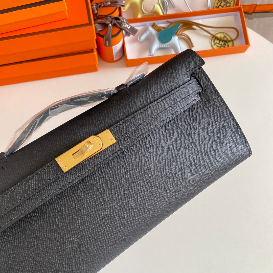 HERMES KELLY CUT 31 IN BLACK CALFSKIN WITH GOLD HARDWARE