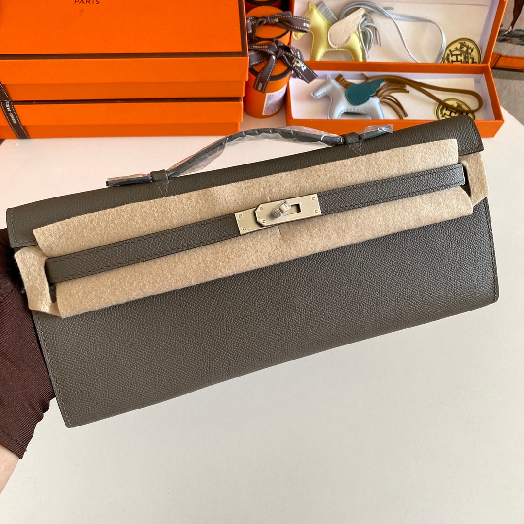 HERMES KELLY CUT 31 IN WOOD BROWN CALFSKIN WITH SILVER HARDWARE