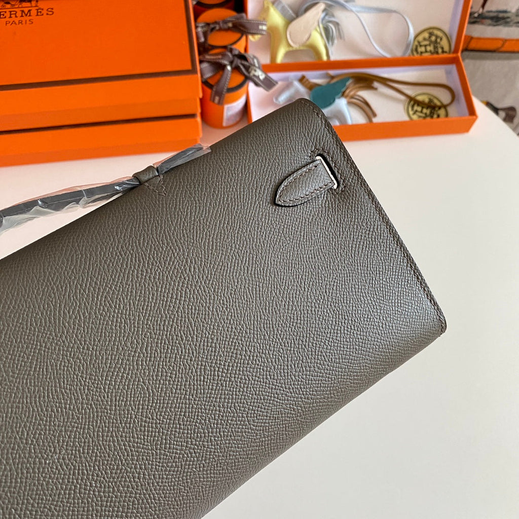 HERMES KELLY CUT 31 IN WOOD BROWN CALFSKIN WITH SILVER HARDWARE