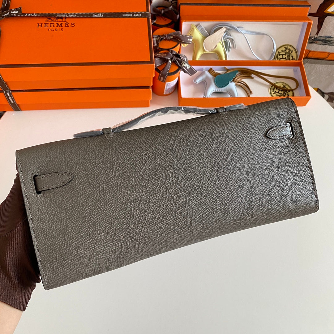 HERMES KELLY CUT 31 IN WOOD BROWN CALFSKIN WITH SILVER HARDWARE