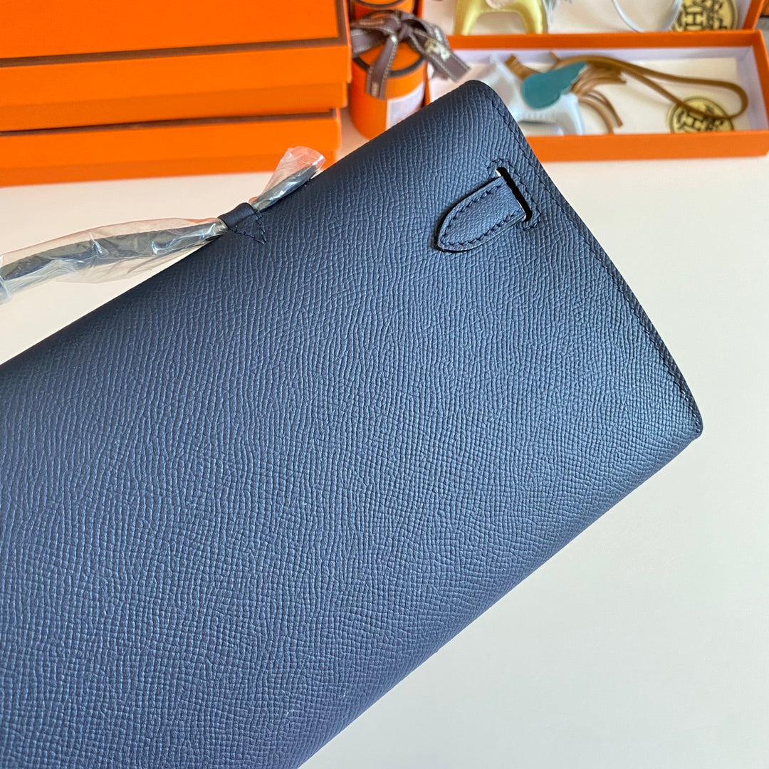 HERMES KELLY CUT 31 IN CLASSIC BLUE CALFSKIN WITH GOLD HARDWARE
