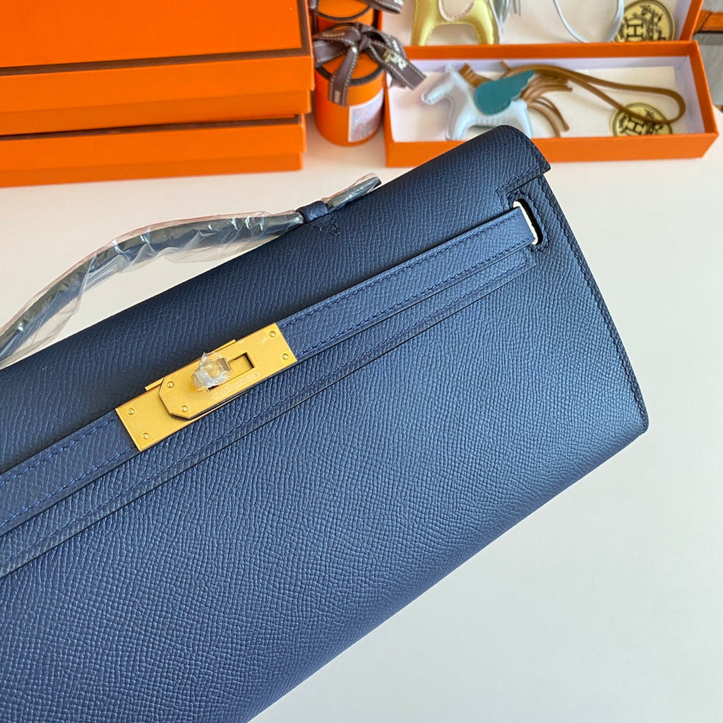 HERMES KELLY CUT 31 IN CLASSIC BLUE CALFSKIN WITH GOLD HARDWARE