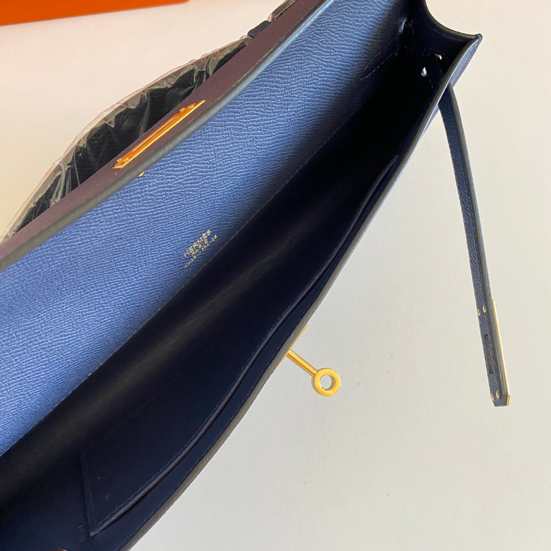 HERMES KELLY CUT 31 IN CLASSIC BLUE CALFSKIN WITH GOLD HARDWARE