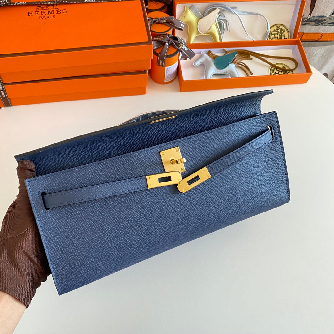 HERMES KELLY CUT 31 IN CLASSIC BLUE CALFSKIN WITH GOLD HARDWARE