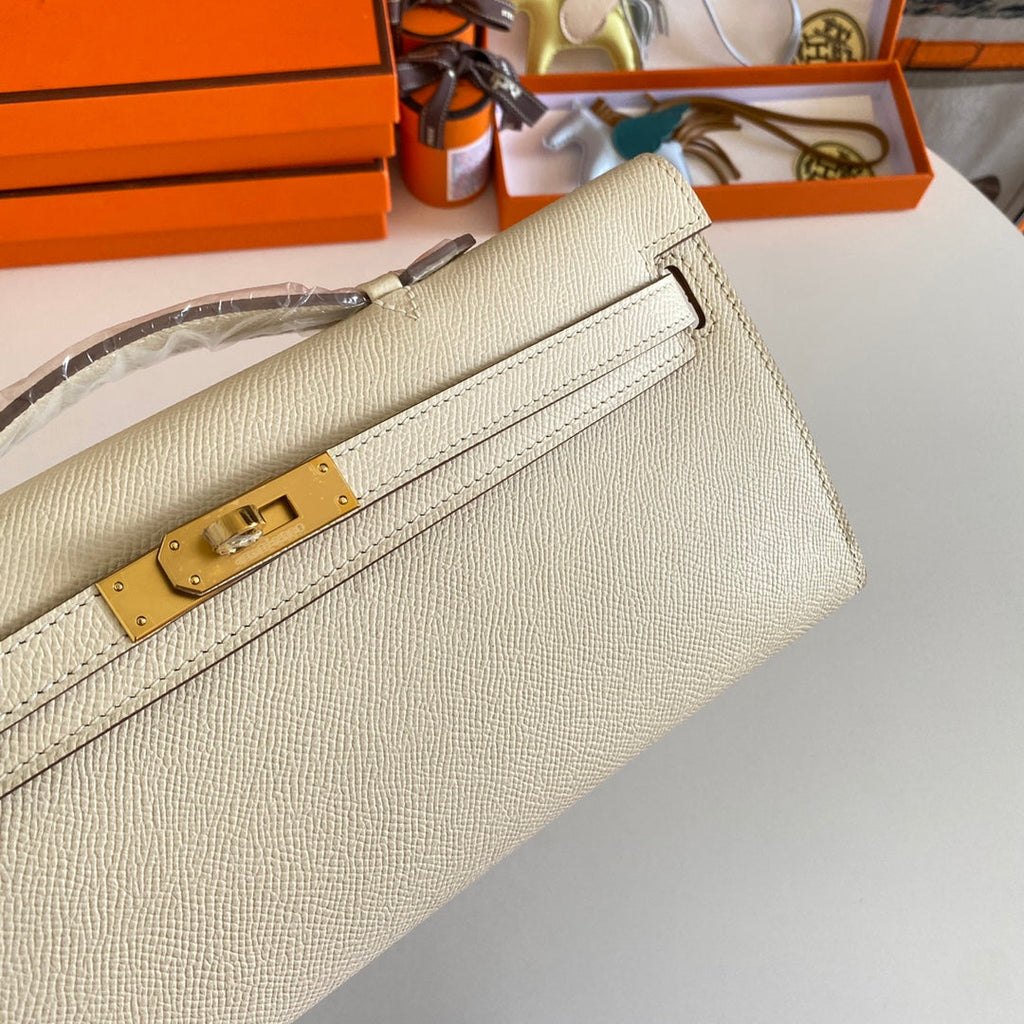 HERMES KELLY CUT 31 IN BEIGE CREAM CALFSKIN WITH GOLD HARDWARE