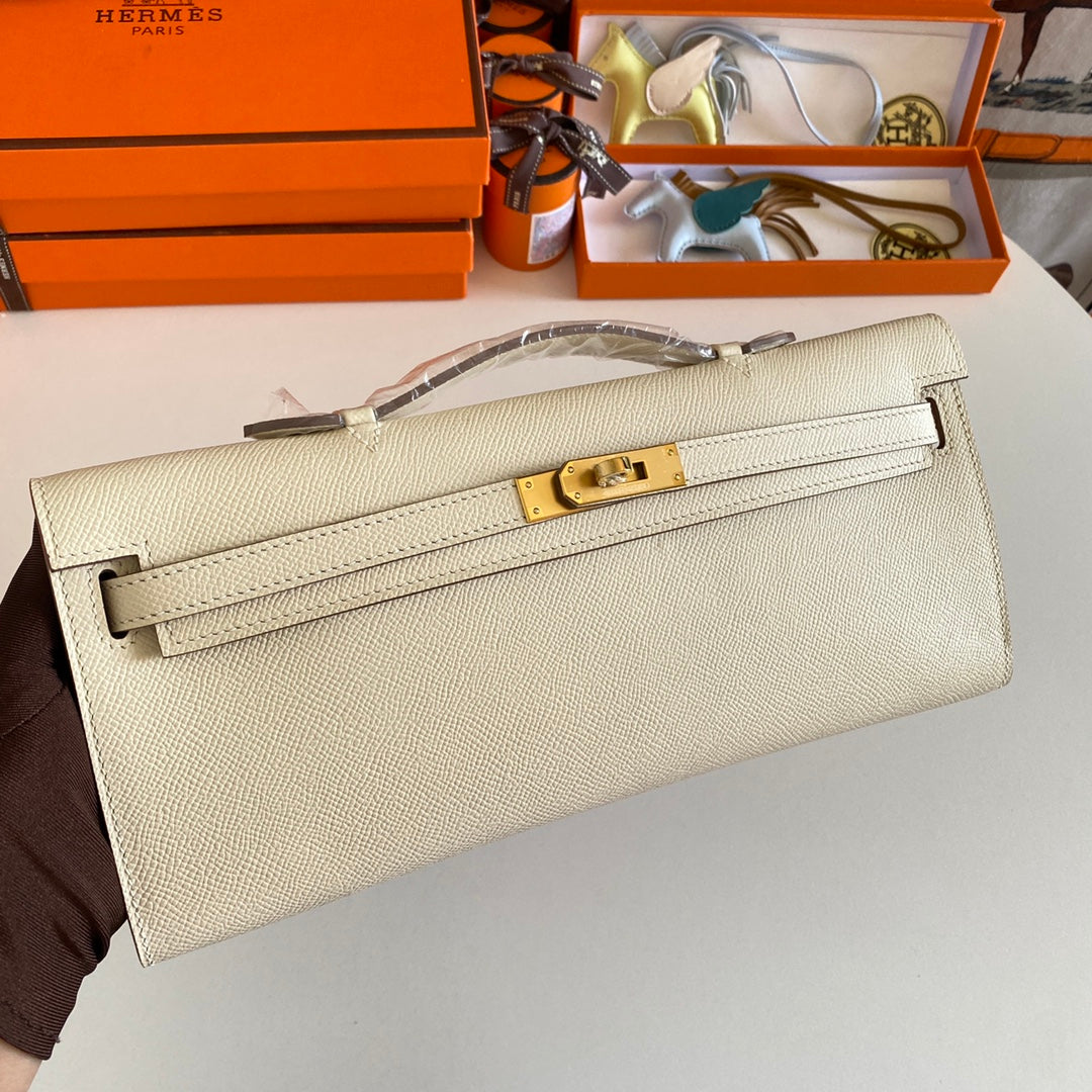 HERMES KELLY CUT 31 IN BEIGE CREAM CALFSKIN WITH GOLD HARDWARE