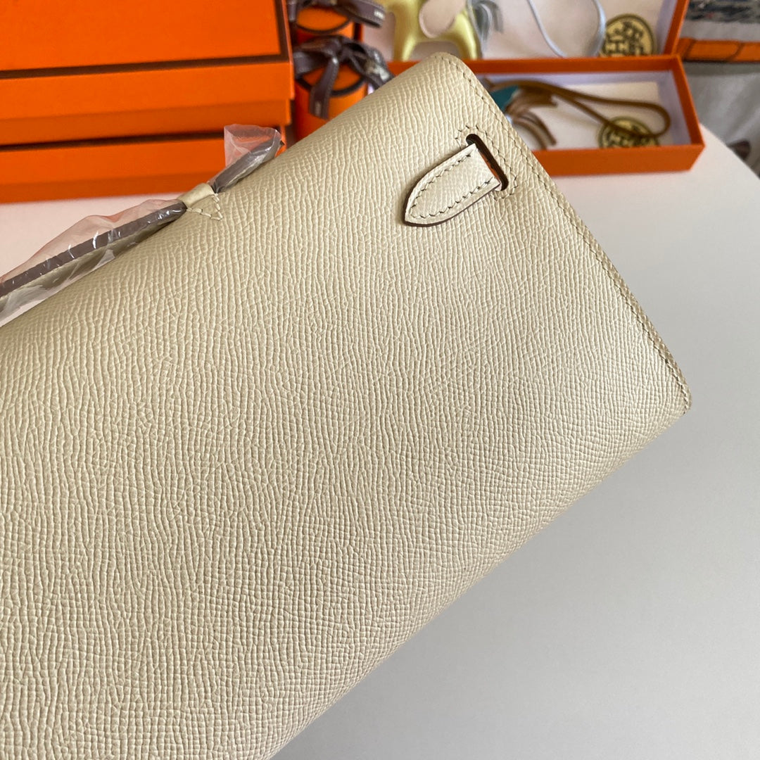 HERMES KELLY CUT 31 IN BEIGE CREAM CALFSKIN WITH GOLD HARDWARE