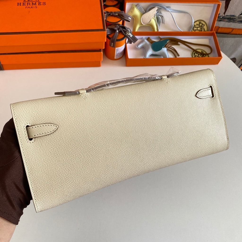 HERMES KELLY CUT 31 IN BEIGE CREAM CALFSKIN WITH GOLD HARDWARE
