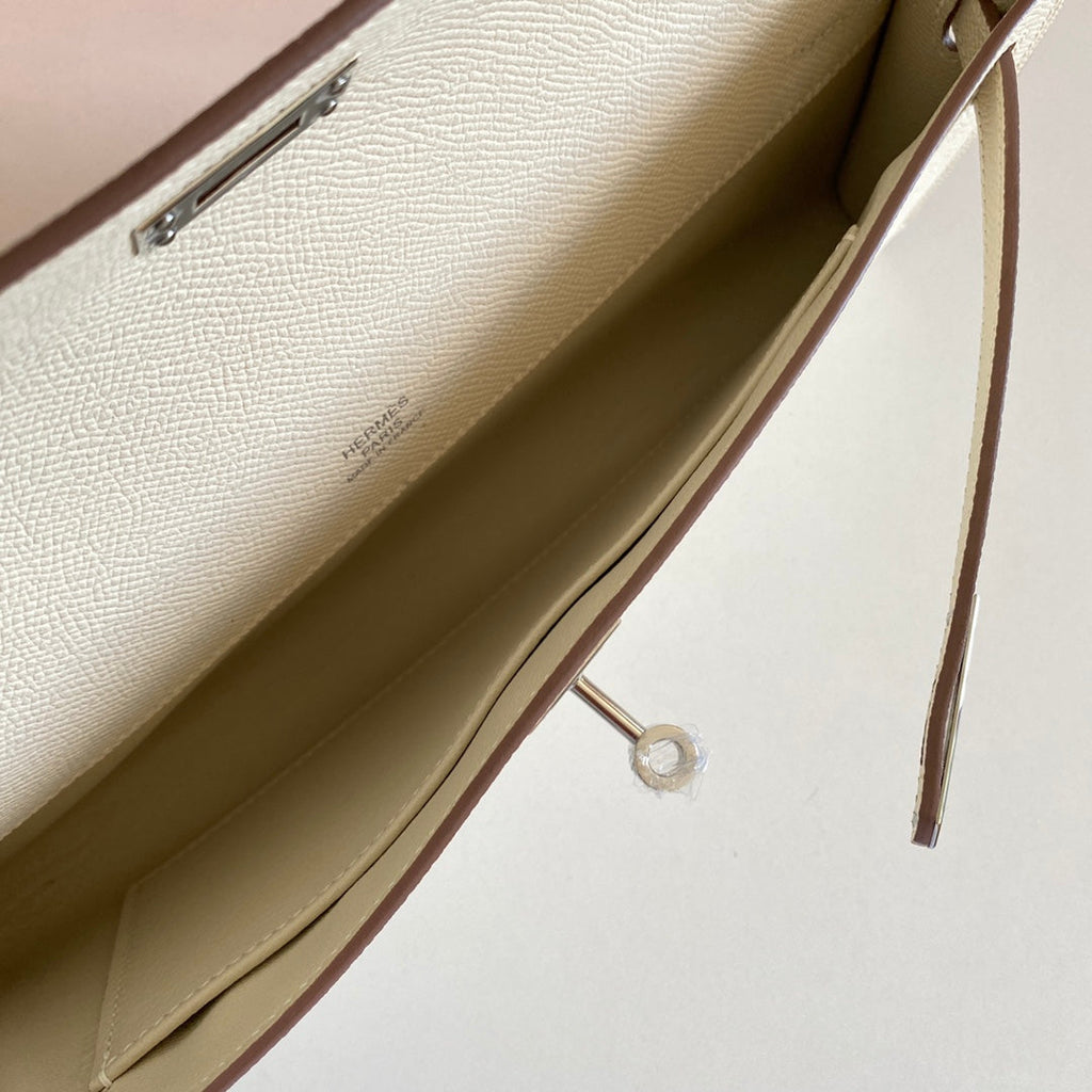 HERMES KELLY CUT 31 IN BEIGE CREAM CALFSKIN WITH SILVER HARDWARE