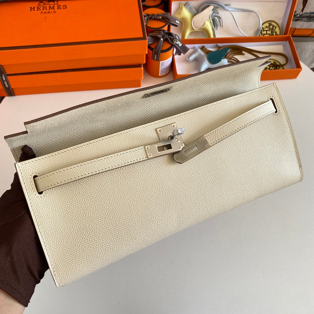HERMES KELLY CUT 31 IN BEIGE CREAM CALFSKIN WITH SILVER HARDWARE