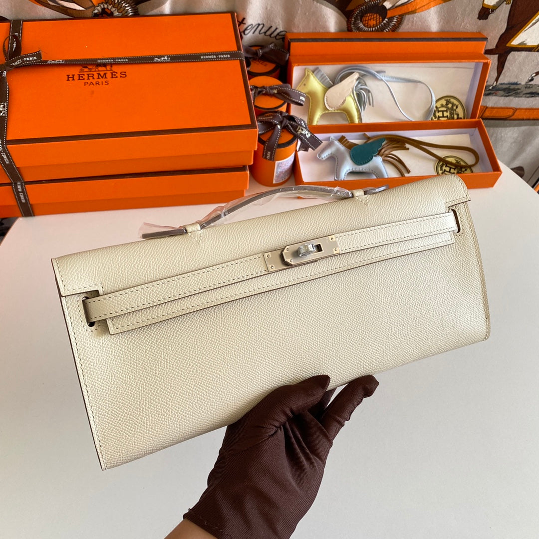 HERMES KELLY CUT 31 IN BEIGE CREAM CALFSKIN WITH SILVER HARDWARE