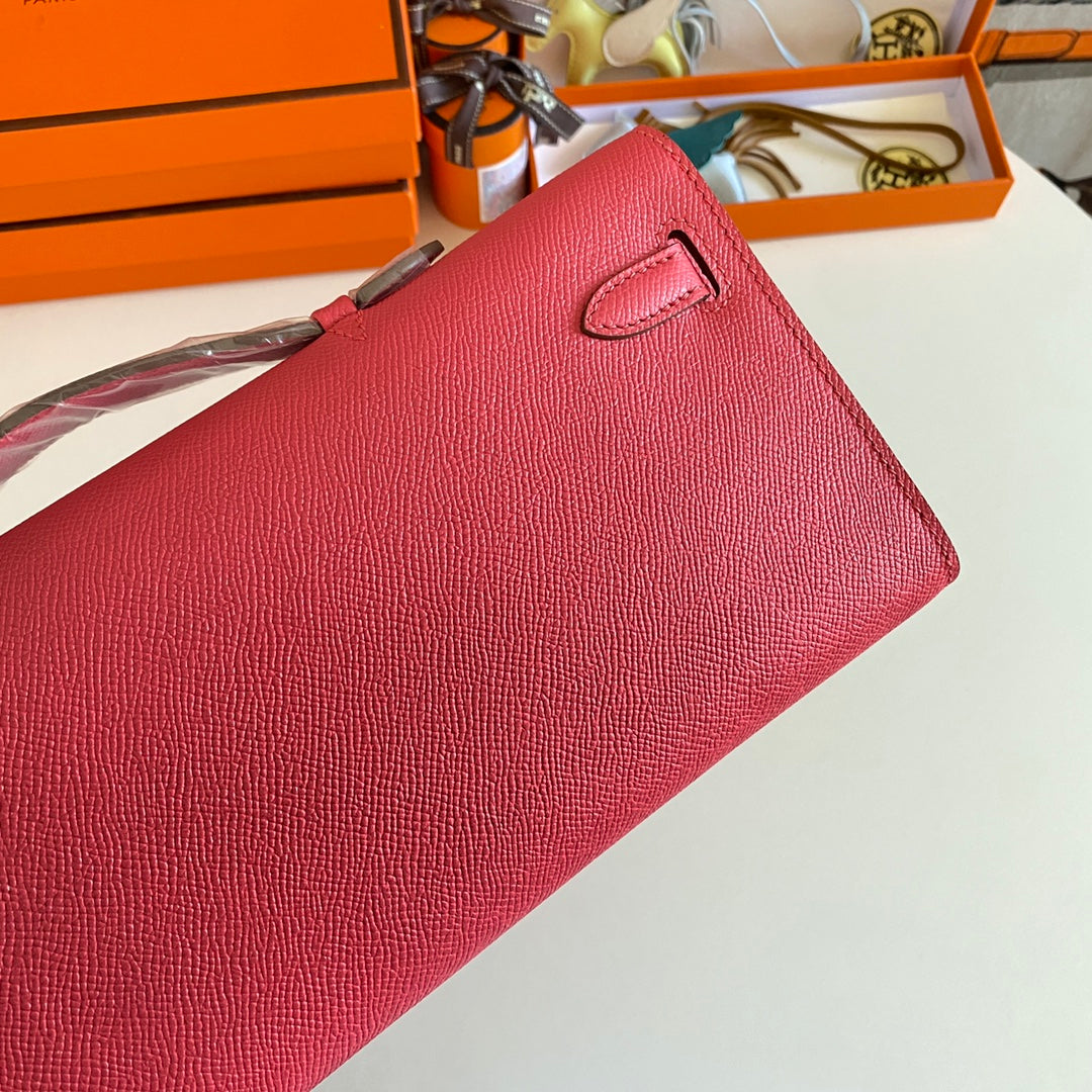 HERMES KELLY CUT 31 IN WATERMELON PINK CALFSKIN WITH GOLD HARDWARE