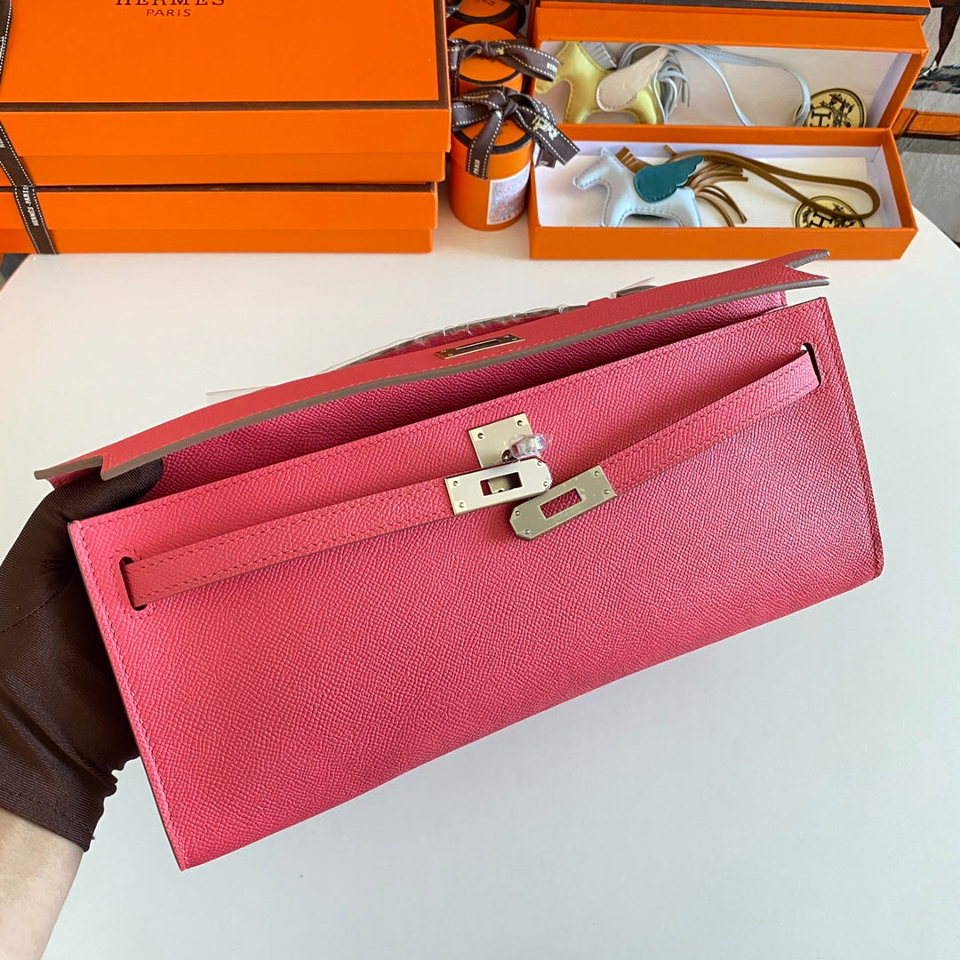 HERMES KELLY CUT 31 IN WATERMELON PINK CALFSKIN WITH SILVER HARDWARE