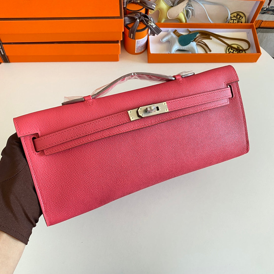 HERMES KELLY CUT 31 IN WATERMELON PINK CALFSKIN WITH SILVER HARDWARE