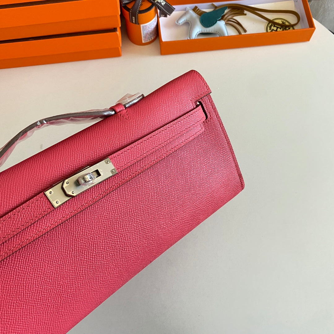 HERMES KELLY CUT 31 IN WATERMELON PINK CALFSKIN WITH SILVER HARDWARE