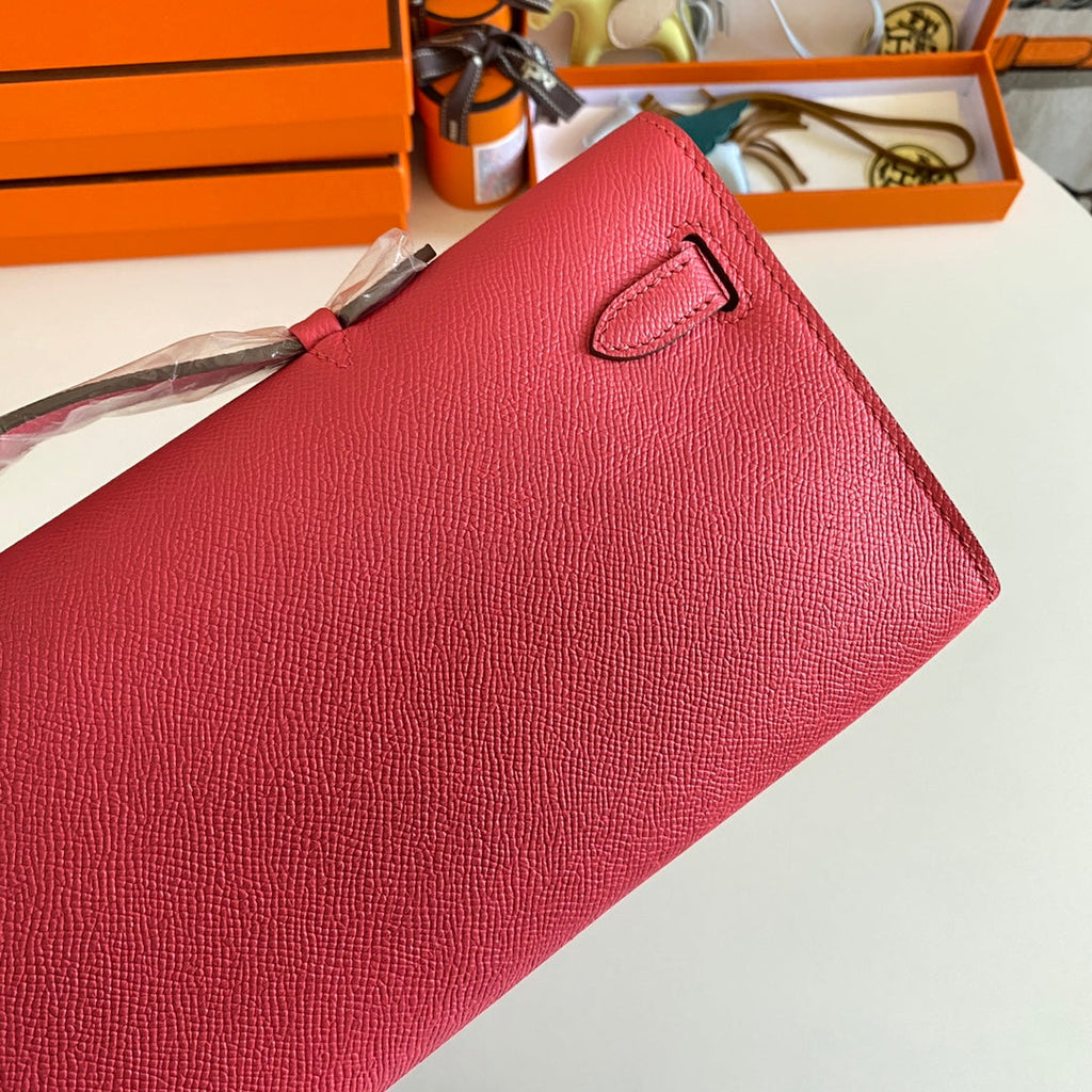 HERMES KELLY CUT 31 IN WATERMELON PINK CALFSKIN WITH SILVER HARDWARE