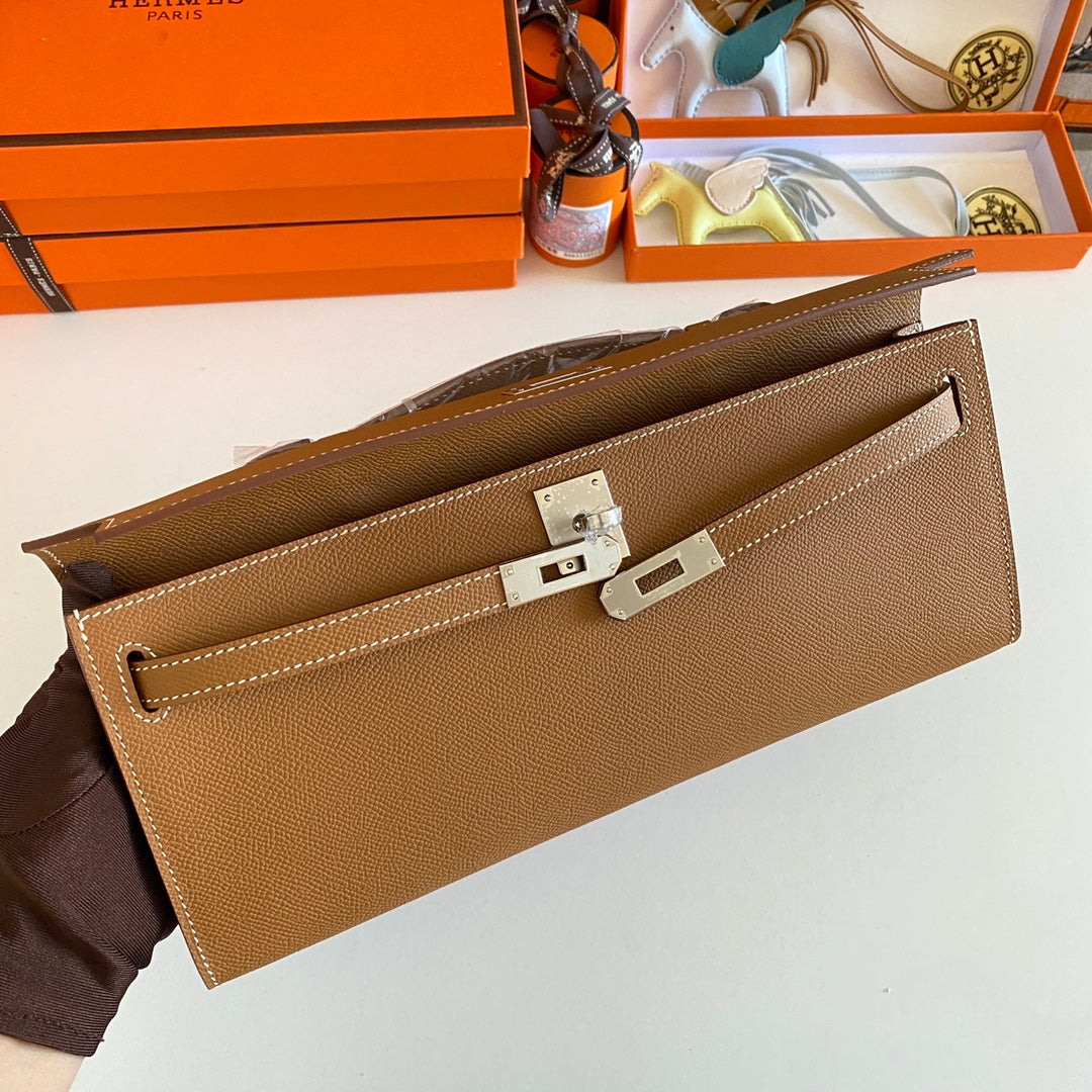 HERMES KELLY CUT 31 IN BRONZE BROWN CALFSKIN WITH SILVER HARDWARE