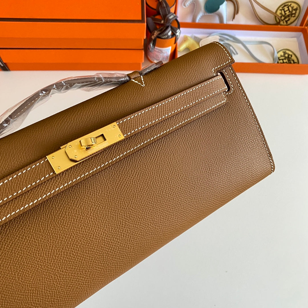 HERMES KELLY CUT 31 IN BRONZE BROWN CALFSKIN WITH GOLD HARDWARE