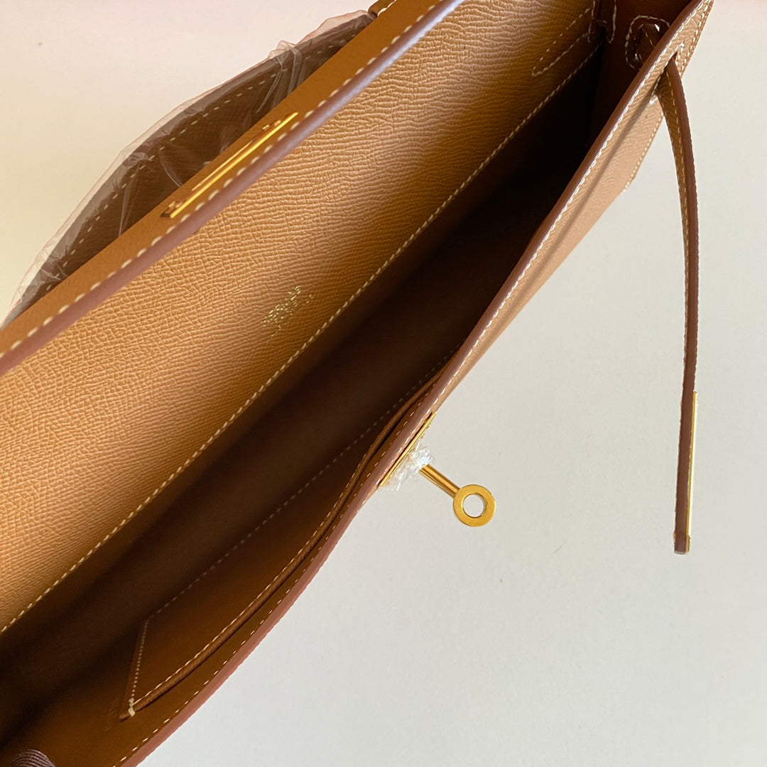 HERMES KELLY CUT 31 IN BRONZE BROWN CALFSKIN WITH GOLD HARDWARE