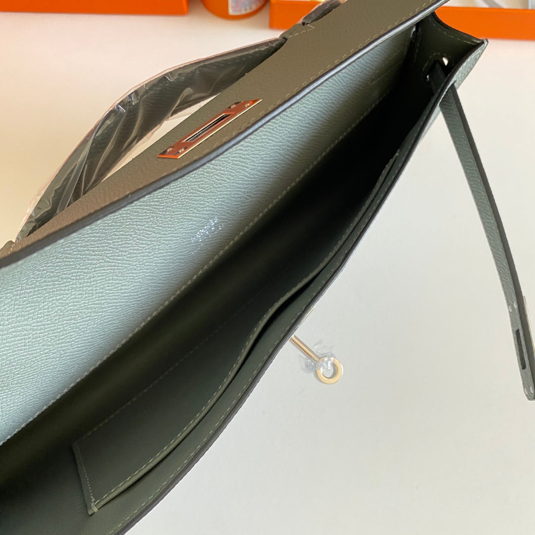 HERMES KELLY CUT 31 IN SEAFOAM GREEN CALFSKIN WITH SILVER HARDWARE