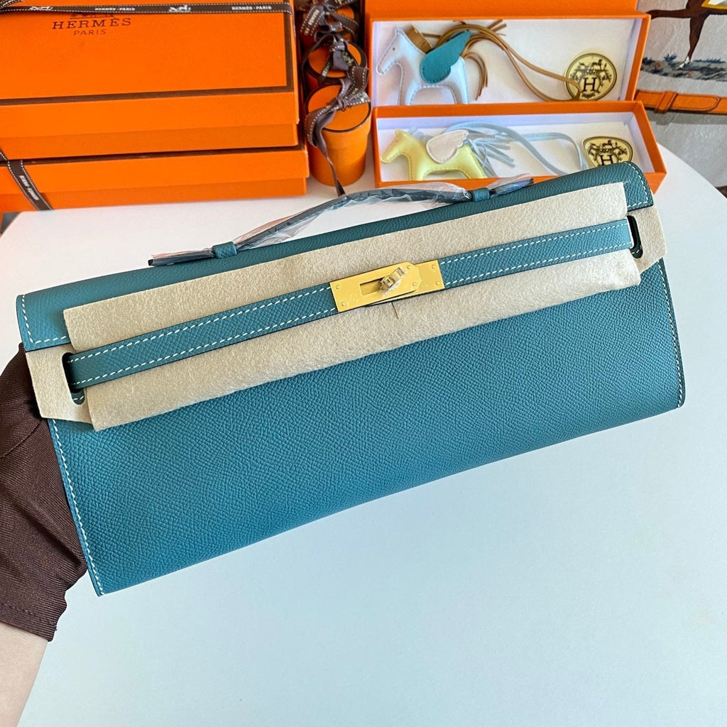 HERMES KELLY CUT 31 IN AZURE BLUE CALFSKIN WITH GOLD HARDWARE