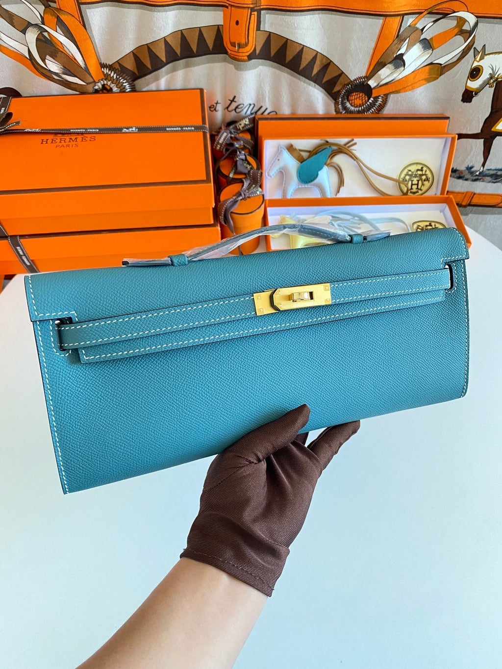 HERMES KELLY CUT 31 IN AZURE BLUE CALFSKIN WITH GOLD HARDWARE