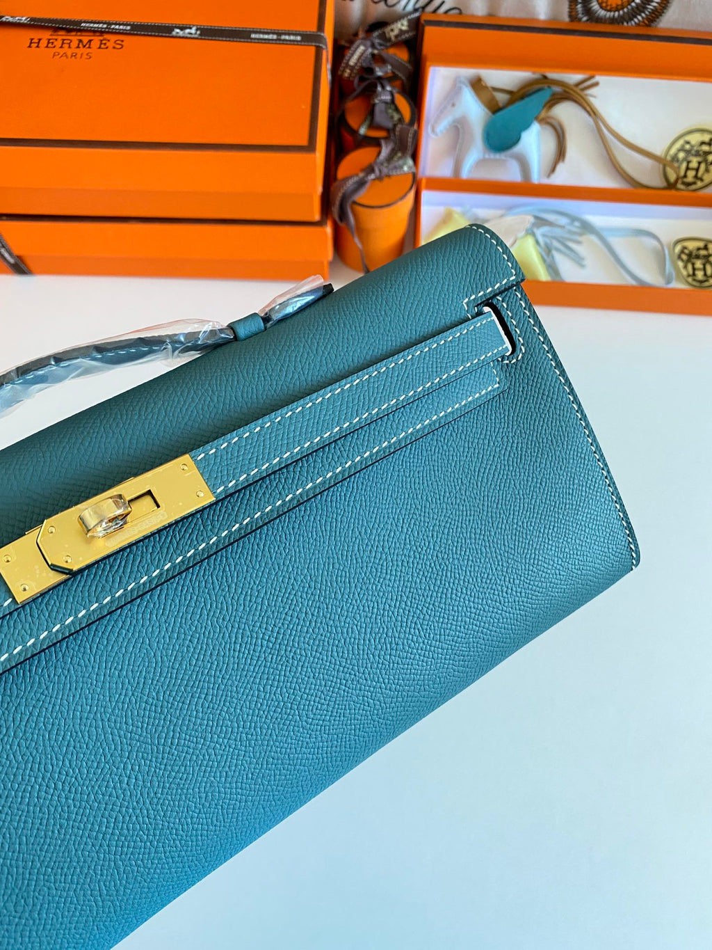 HERMES KELLY CUT 31 IN AZURE BLUE CALFSKIN WITH GOLD HARDWARE
