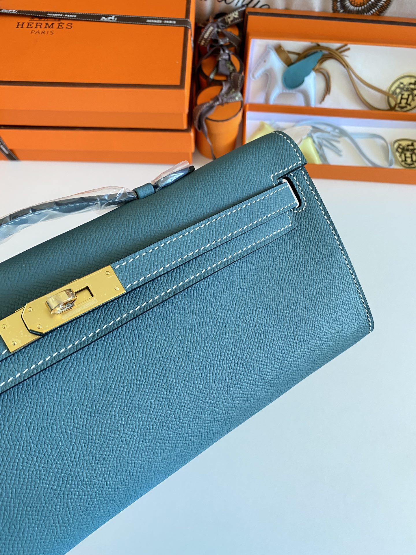 HERMES KELLY CUT 31 IN AZURE BLUE CALFSKIN WITH GOLD HARDWARE