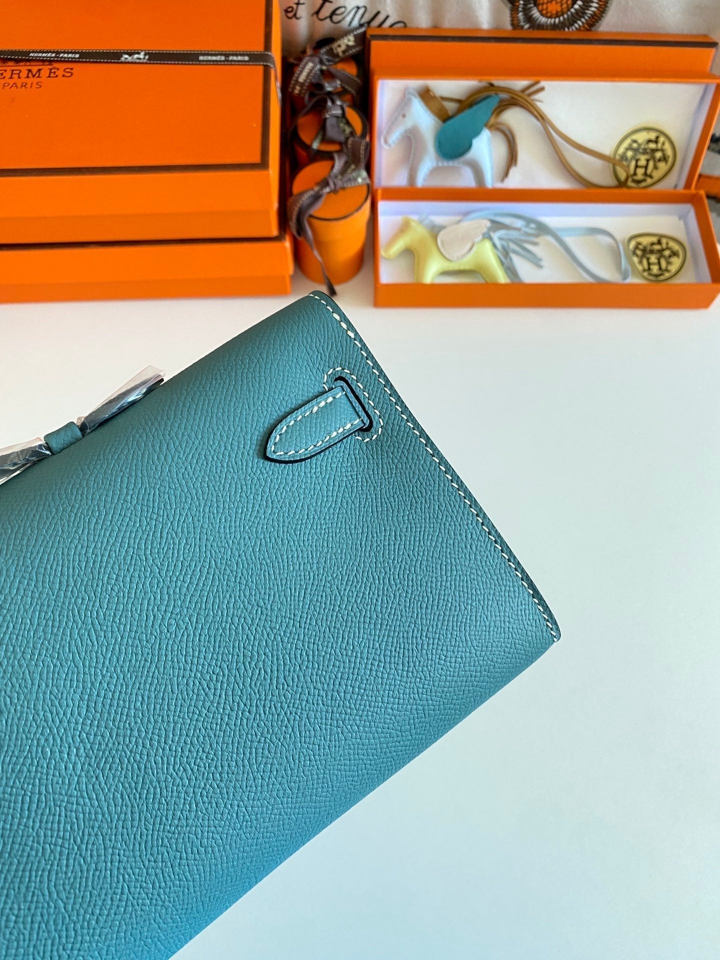 HERMES KELLY CUT 31 IN AZURE BLUE CALFSKIN WITH GOLD HARDWARE