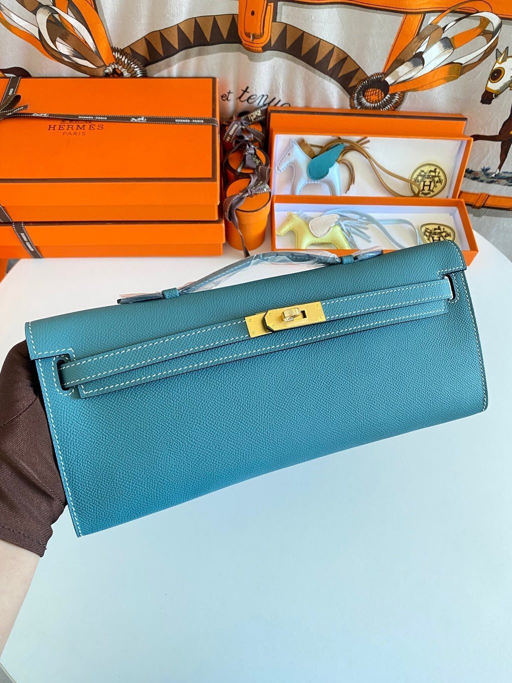 HERMES KELLY CUT 31 IN AZURE BLUE CALFSKIN WITH GOLD HARDWARE